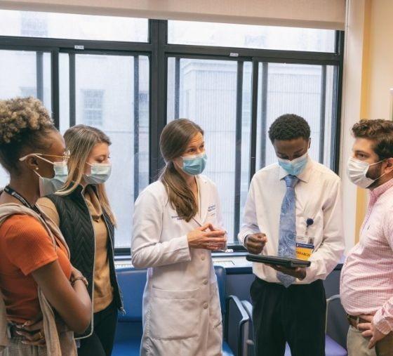 A group of clinicians in discussion